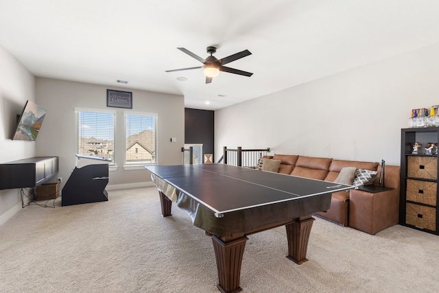 recreation room featuring baseboards, a ceiling fan, visible vents, and light colored carpet