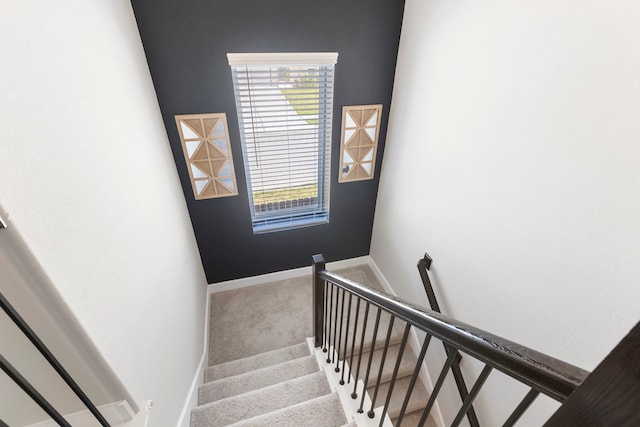 staircase with carpet and baseboards