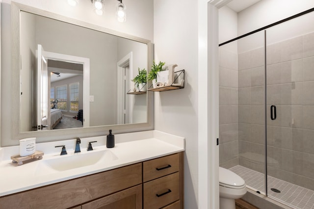 full bath featuring a stall shower, vanity, toilet, and ensuite bathroom