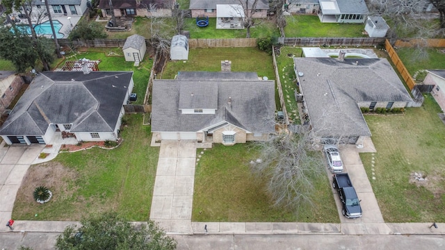 birds eye view of property with a residential view