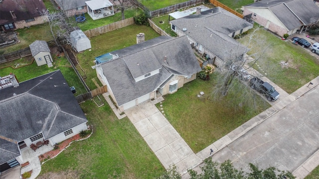 birds eye view of property with a residential view