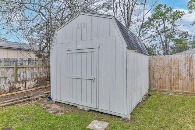 view of shed featuring a fenced backyard