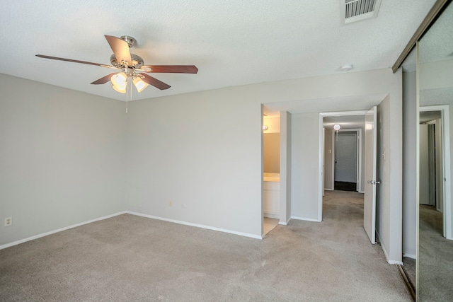 7627 Secretariat Ln, Houston, TX 77071 - unfurnished bedroom featuring ceiling fan, a textured ceiling, light carpet, visible vents, and baseboards