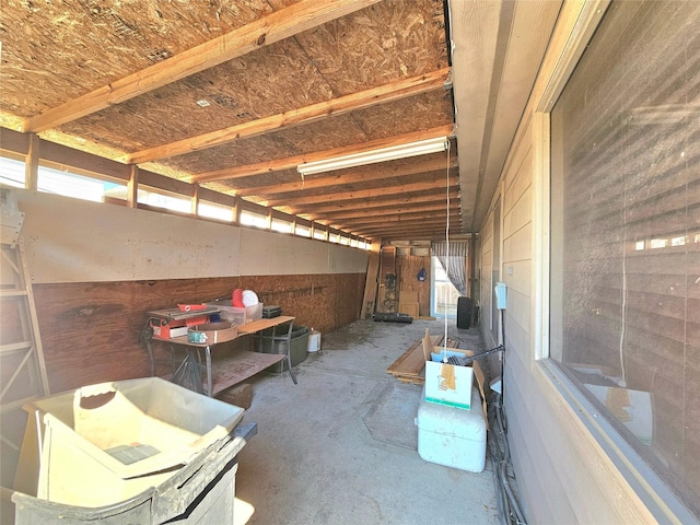 interior space with unfinished concrete flooring