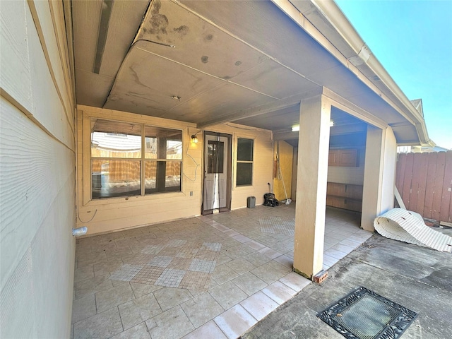 view of patio featuring fence