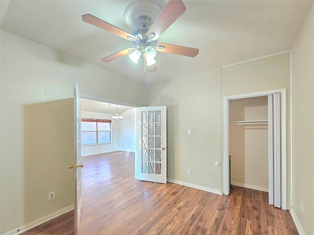 unfurnished bedroom with baseboards and wood finished floors