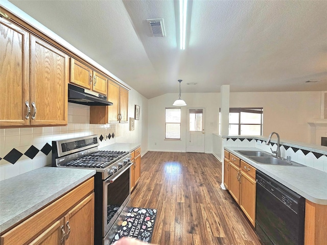 kitchen featuring black dishwasher, visible vents, gas range, under cabinet range hood, and a sink