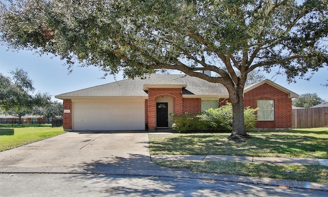 ranch-style house featuring brick siding, concrete driveway, fence, a garage, and a front lawn