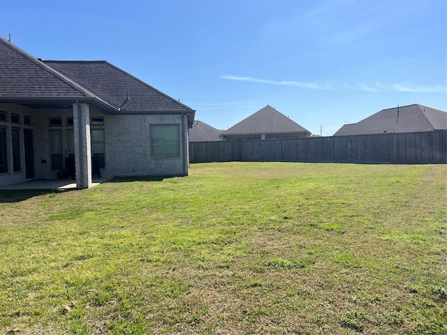 view of yard with a patio area and fence