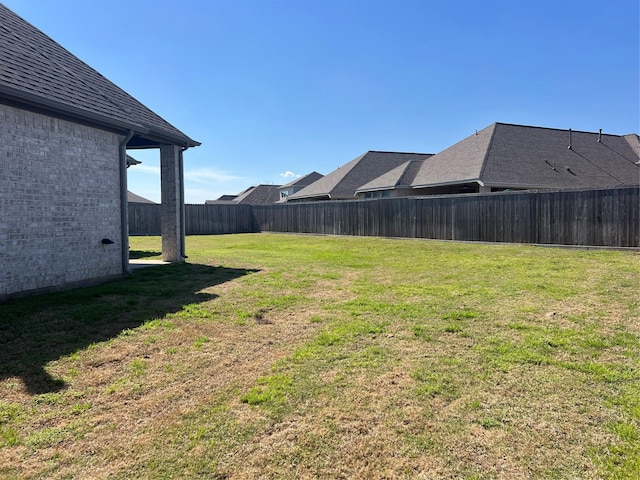 view of yard featuring a fenced backyard