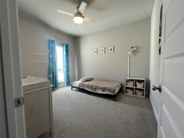 carpeted bedroom with a ceiling fan