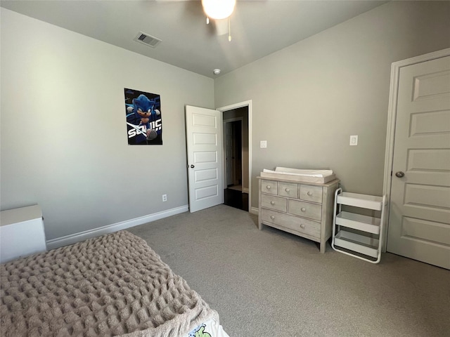 carpeted bedroom featuring visible vents, ceiling fan, and baseboards