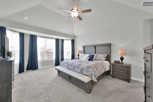 carpeted bedroom with lofted ceiling, a ceiling fan, visible vents, and baseboards