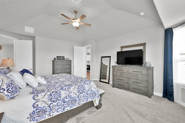 bedroom featuring carpet floors, vaulted ceiling, baseboards, and a ceiling fan