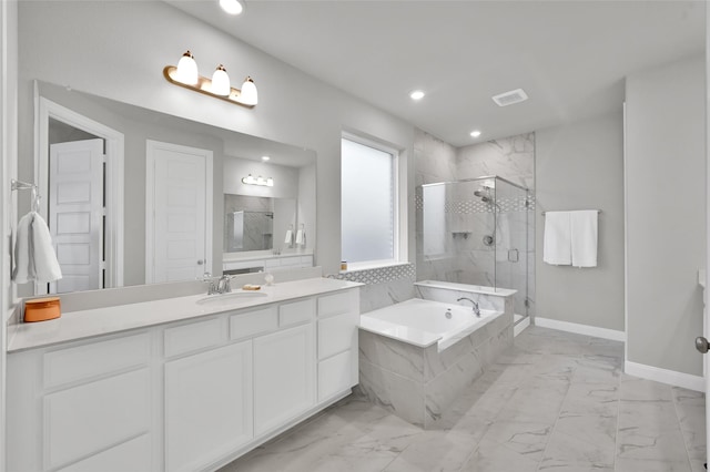 full bath with marble finish floor, a garden tub, a shower stall, vanity, and baseboards