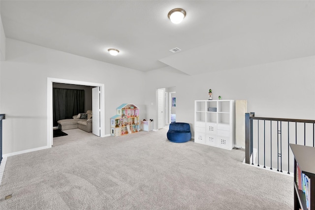 recreation room with carpet flooring, visible vents, and baseboards