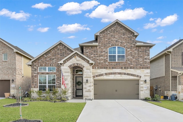 view of front of home featuring stone siding, a front lawn, concrete driveway, and brick siding