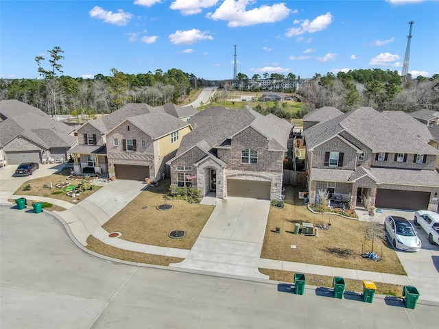 birds eye view of property with a residential view