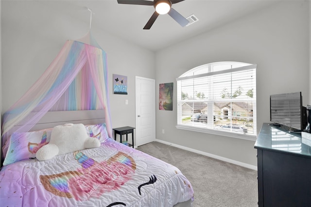 carpeted bedroom with baseboards, visible vents, and a ceiling fan