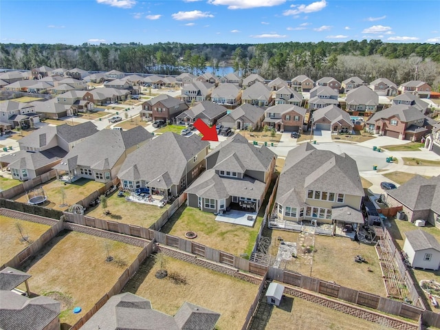 birds eye view of property with a residential view