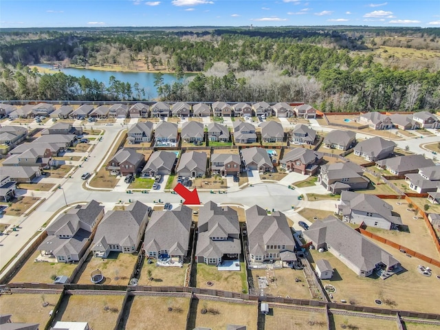 drone / aerial view with a residential view and a water view