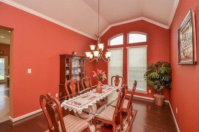 dining area featuring lofted ceiling, a notable chandelier, baseboards, and wood finished floors