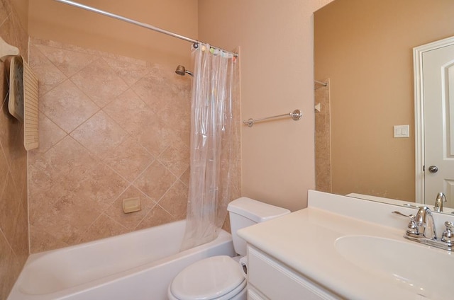 bathroom featuring shower / bath combo, vanity, and toilet