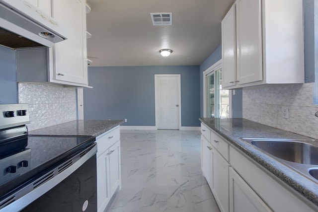 kitchen featuring visible vents, baseboards, stainless steel electric range oven, marble finish floor, and under cabinet range hood