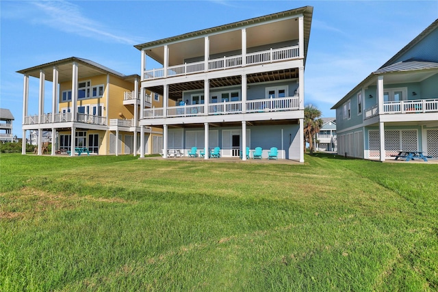 rear view of house with a lawn