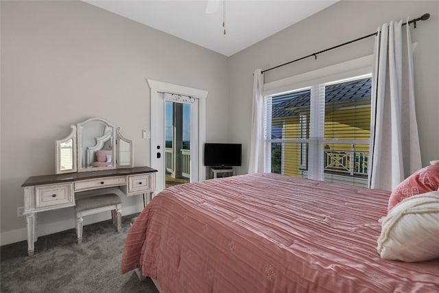 bedroom with baseboards, dark carpet, and ceiling fan