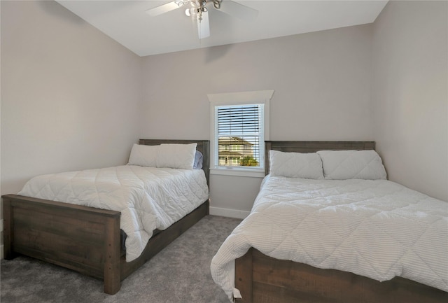 bedroom with dark carpet, baseboards, and ceiling fan