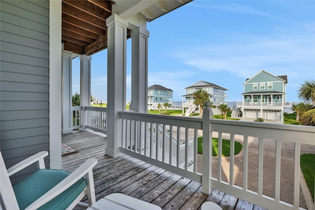 wooden deck featuring a residential view