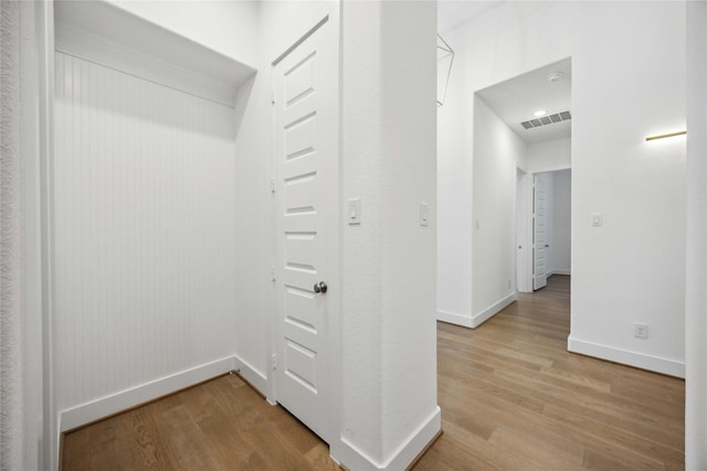 interior space with light wood-style floors and visible vents