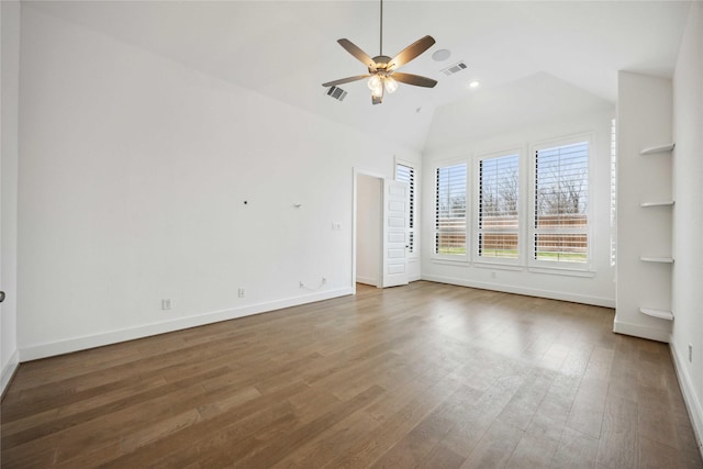 interior space featuring vaulted ceiling, visible vents, wood finished floors, and ceiling fan