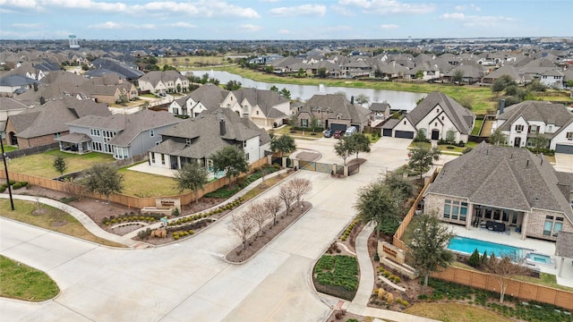 aerial view featuring a residential view and a water view