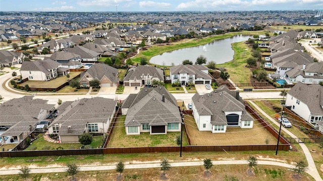 bird's eye view with a water view and a residential view