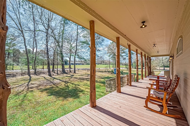 deck featuring a lawn