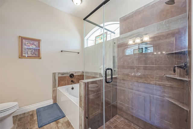 bathroom with toilet, a stall shower, baseboards, and a bath