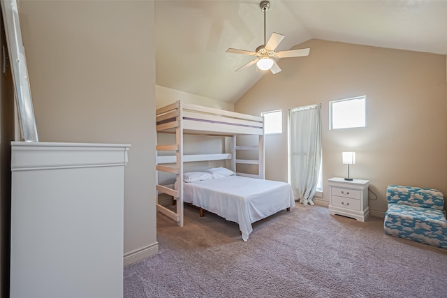 carpeted bedroom featuring lofted ceiling and ceiling fan