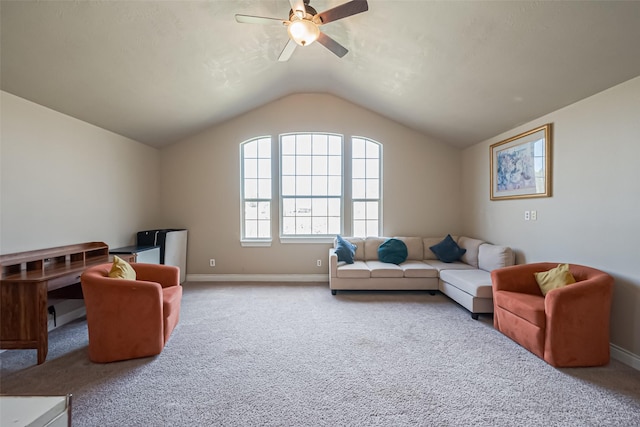 carpeted living area featuring a ceiling fan, vaulted ceiling, and baseboards