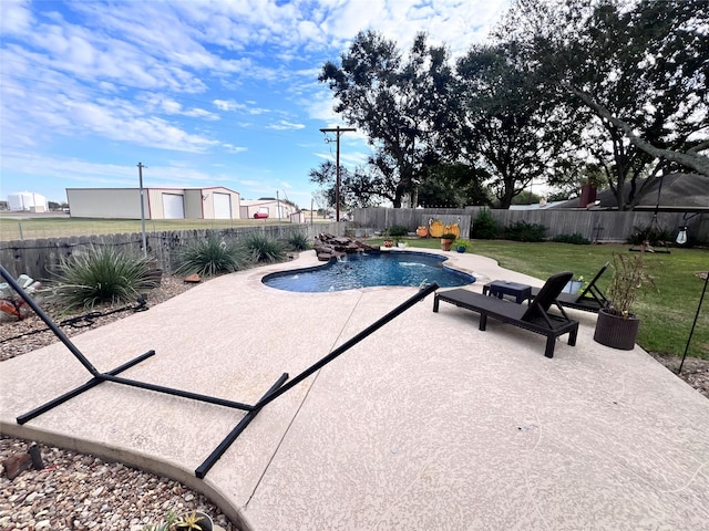 view of pool with a patio, a yard, a fenced backyard, and a fenced in pool