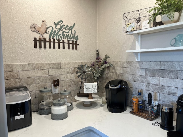 room details featuring open shelves and light countertops