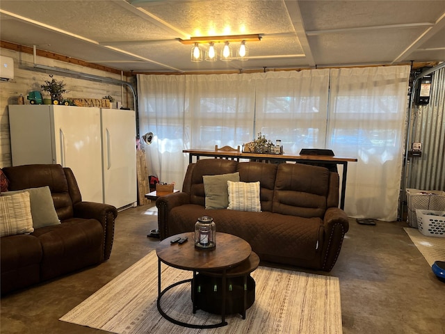 living room featuring concrete flooring and a garage