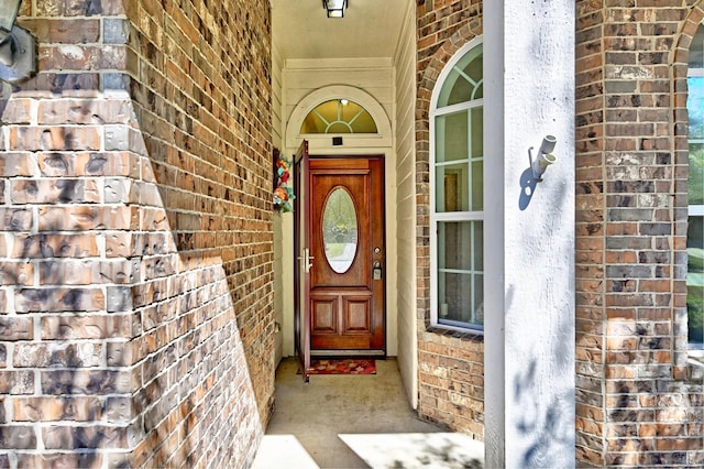 entrance to property with brick siding