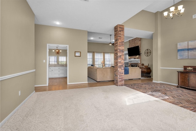 590 Edgewood Dr, Montgomery, TX 77356 - living room with a chandelier, ceiling fan, carpet, and wood finished floors
