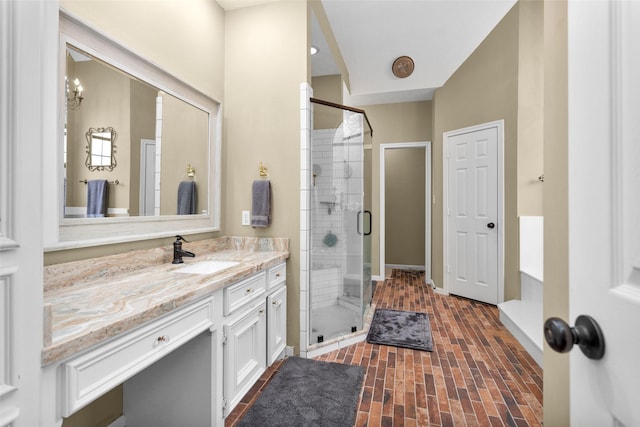 590 Edgewood Dr, Montgomery, TX 77356 - full bathroom featuring vanity, a shower stall, and brick patterned floors