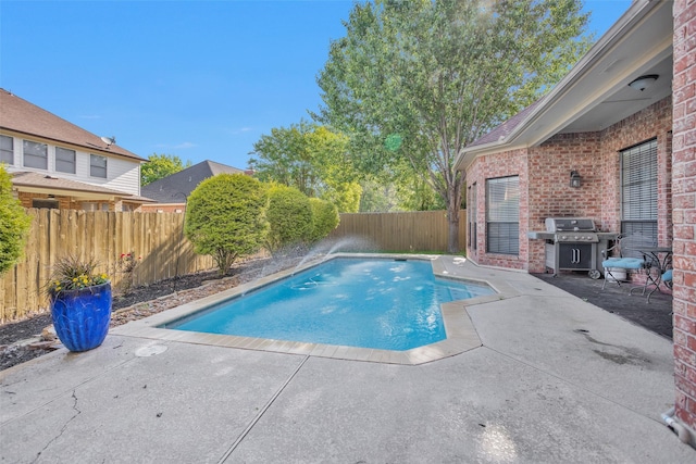 590 Edgewood Dr, Montgomery, TX 77356 - view of swimming pool with grilling area, a patio area, and a fenced backyard