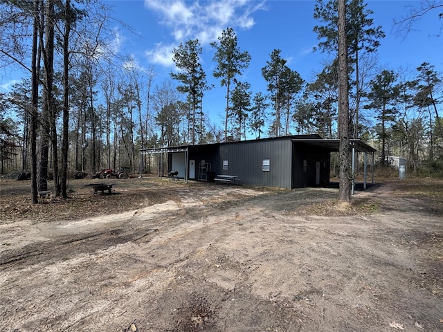 exterior space featuring driveway and a carport