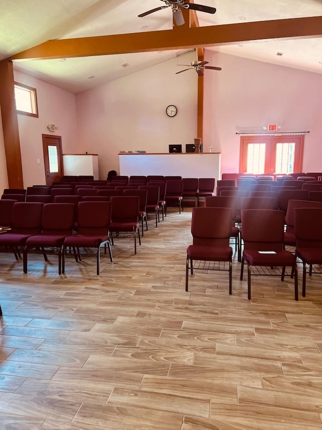 interior space featuring high vaulted ceiling, wood tiled floor, and beam ceiling