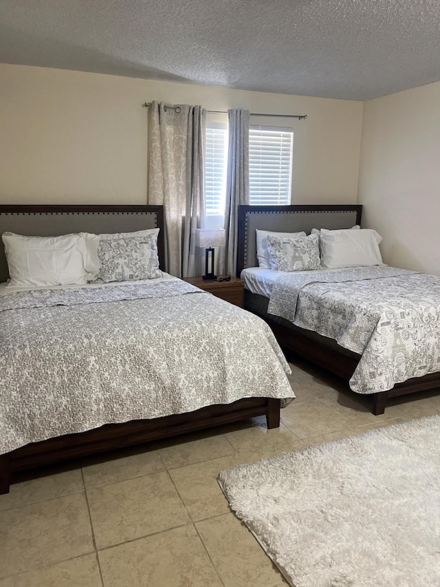 bedroom featuring a textured ceiling